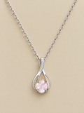 Pink Shell Clover Necklace on a beige background
