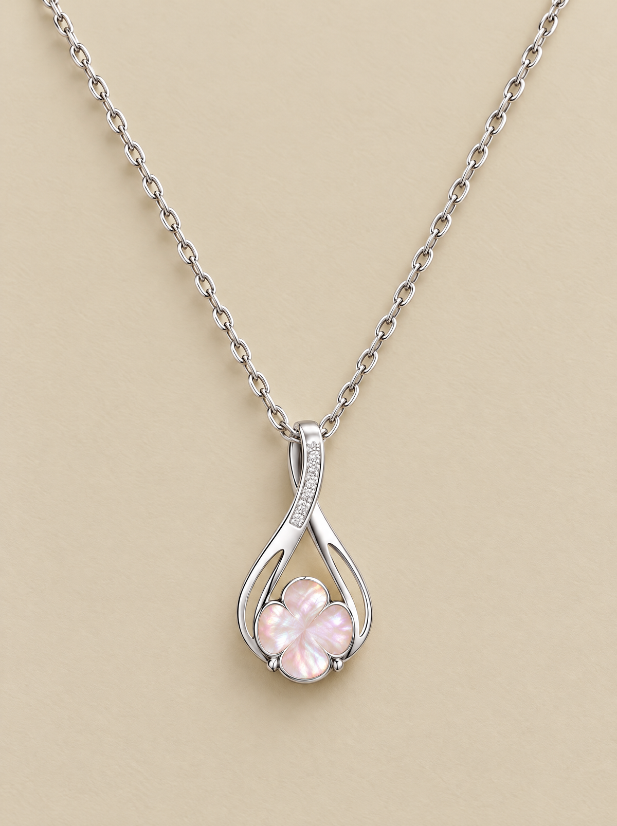 Pink Shell Clover Necklace on a beige background