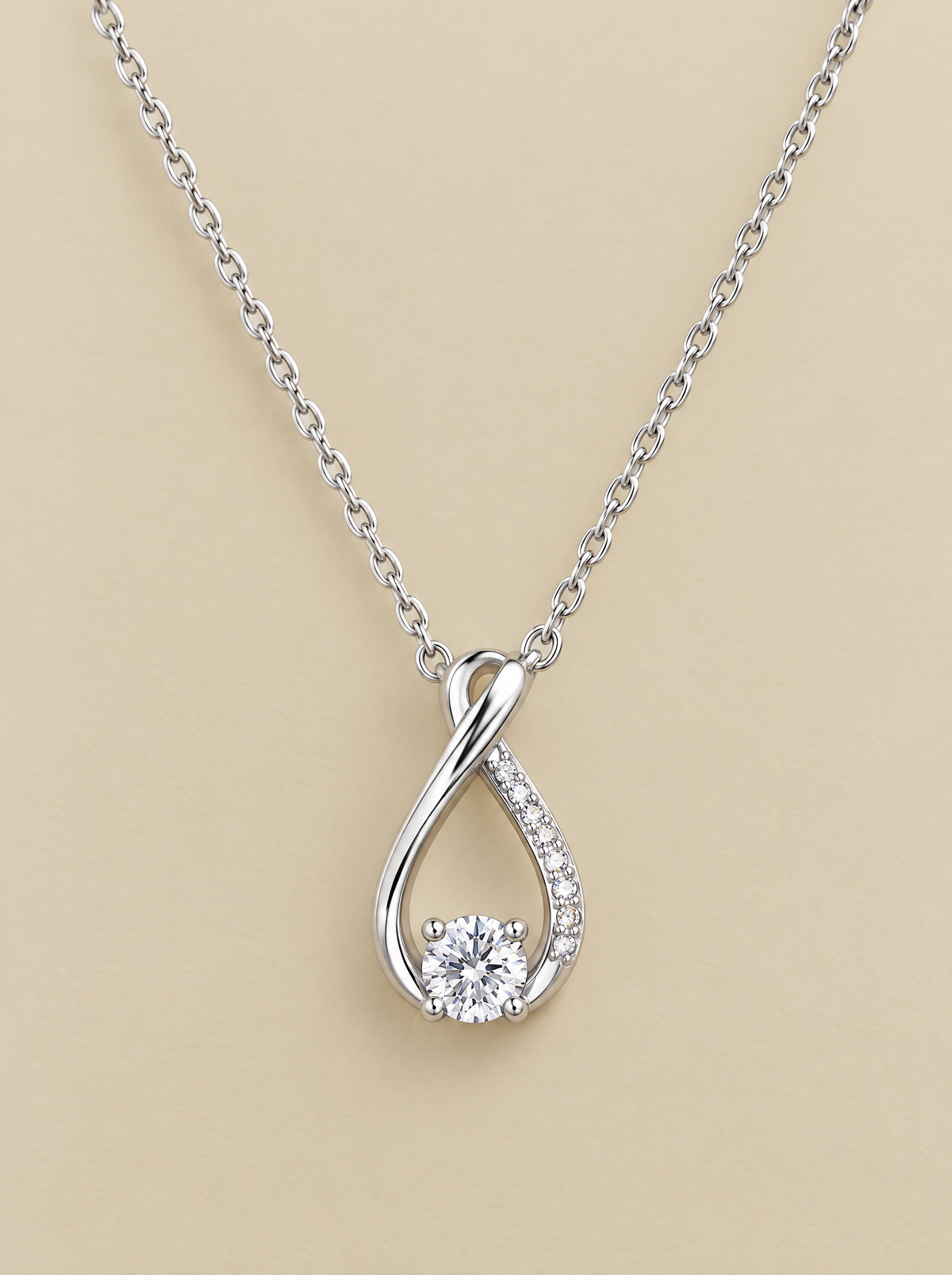 Teardrop Sparkle Necklace on a beige background