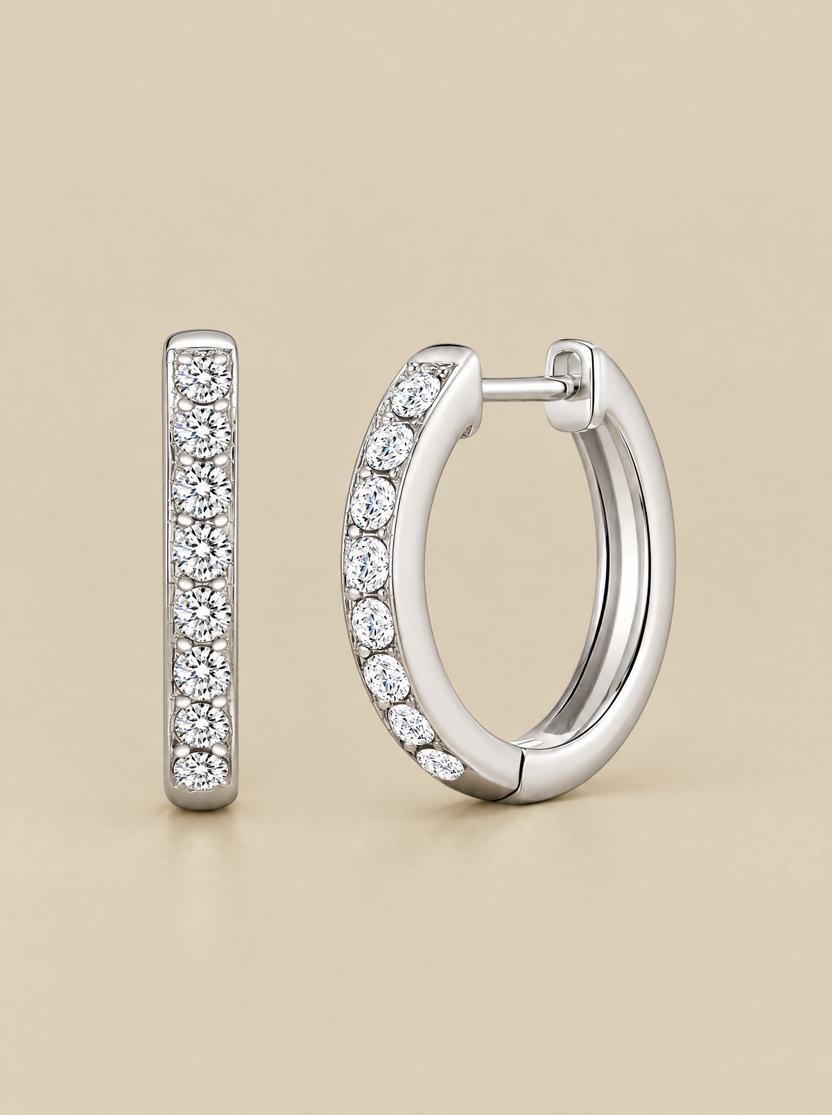 Sparkle Huggie Hoop Earrings on a beige background