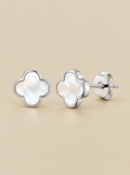 White Pearl Clover Stud Earrings on a beige background