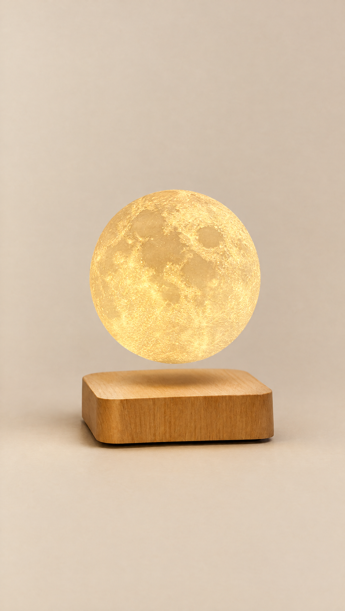 Floating moon lamp glowing above a wooden base